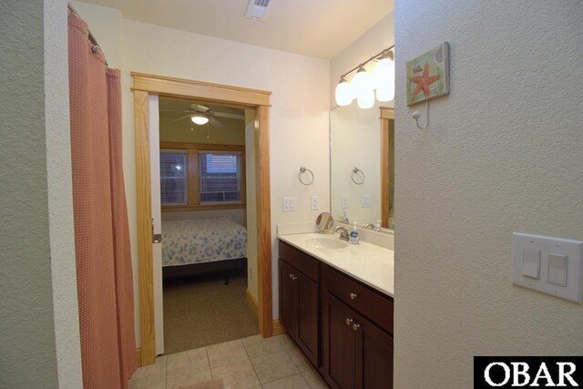 107 W Gray Eagle St Unit 112A, Nags Head, NC 27959 - bathroom featuring vanity, tile patterned flooring, ensuite bathroom, and a ceiling fan