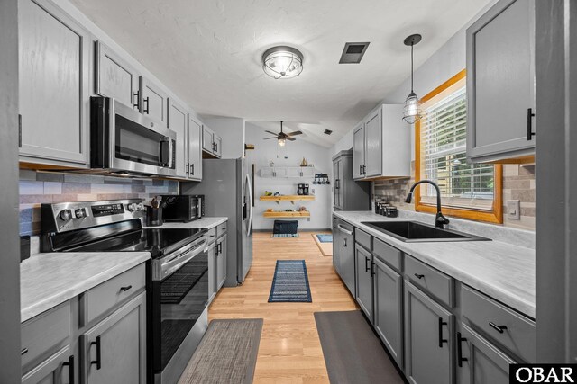 103 Nathan Dr Lot # 2, Grandy, NC 27939 - kitchen featuring stainless steel appliances, gray cabinets, tasteful backsplash, ceiling fan, and lofted ceiling