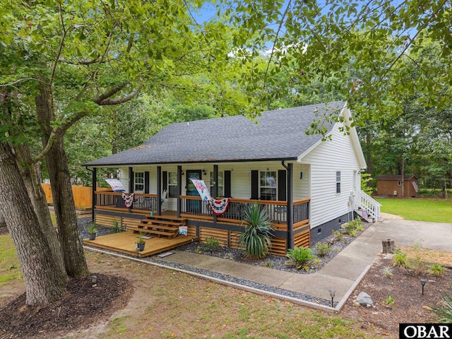 103 Nathan Dr Lot # 2, Grandy, NC 27939 - view of front of house with crawl space, a porch, a shingled roof, and a shed