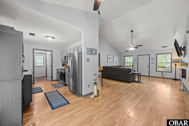 103 Nathan Dr Lot # 2, Grandy, NC 27939 - kitchen with appliances with stainless steel finishes, ceiling fan, light wood-style flooring, open floor plan, and high vaulted ceiling
