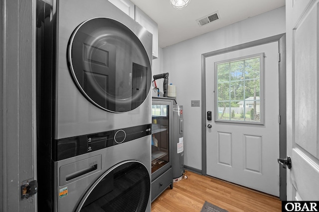 103 Nathan Dr Lot # 2, Grandy, NC 27939 - laundry area featuring estacked washer and dryer and light wood-style flooring
