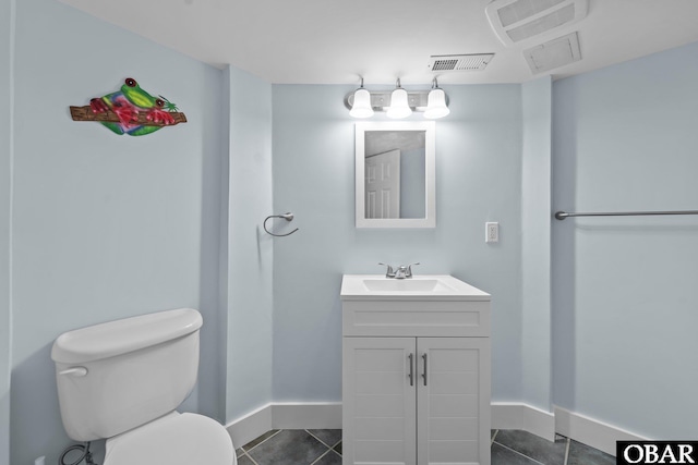 bathroom featuring visible vents, toilet, tile patterned flooring, baseboards, and vanity