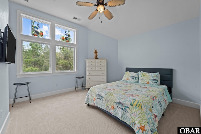 carpeted bedroom featuring visible vents, baseboards, and a ceiling fan