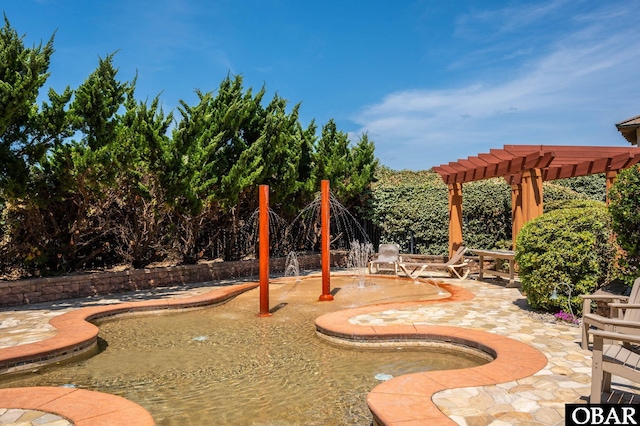 view of jungle gym with a pergola and a patio