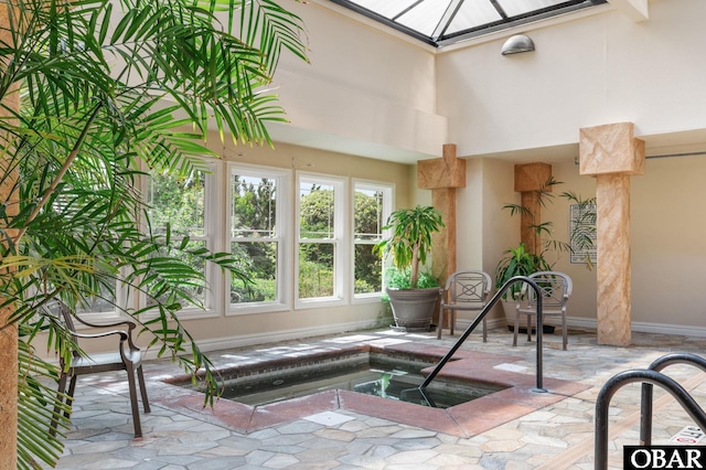 sunroom featuring a jacuzzi