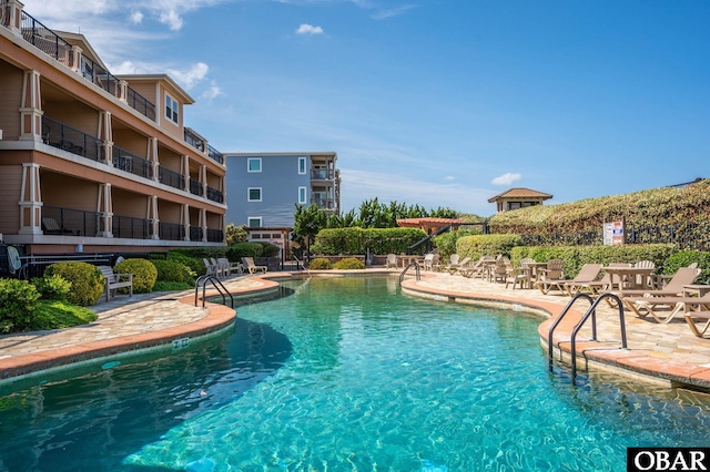 community pool featuring a patio area