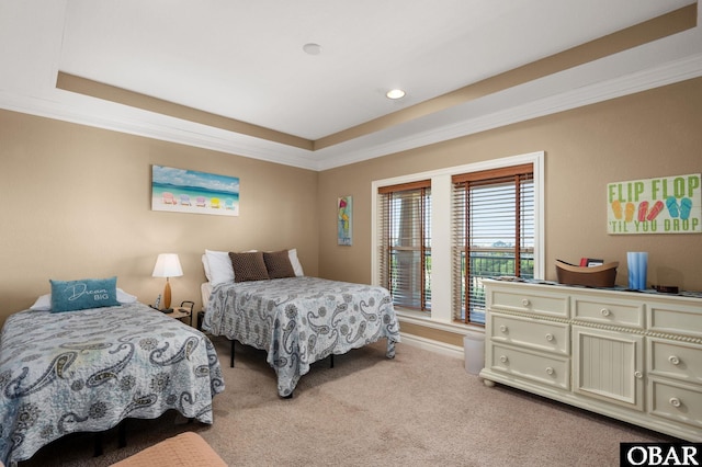 bedroom with ornamental molding, carpet flooring, a raised ceiling, and recessed lighting
