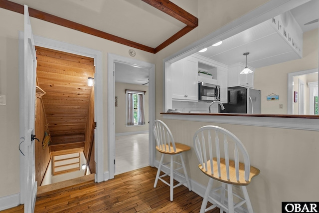 56 Ginguite Trl Lot 9, Southern Shores, NC 27949 - kitchen featuring stainless steel appliances, wood finished floors, white cabinets, open shelves, and baseboards