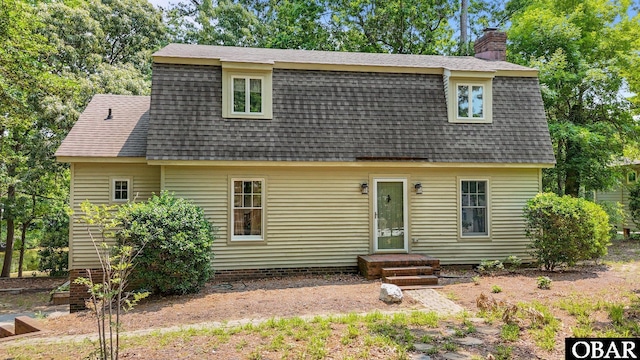 56 Ginguite Trl Lot 9, Southern Shores, NC 27949 - view of front of house with roof with shingles and a chimney