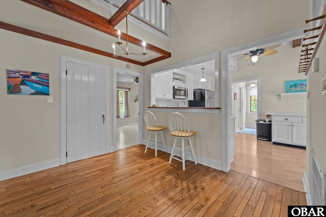 56 Ginguite Trl Lot 9, Southern Shores, NC 27949 - kitchen with a ceiling fan, freestanding refrigerator, light wood-style floors, and healthy amount of natural light