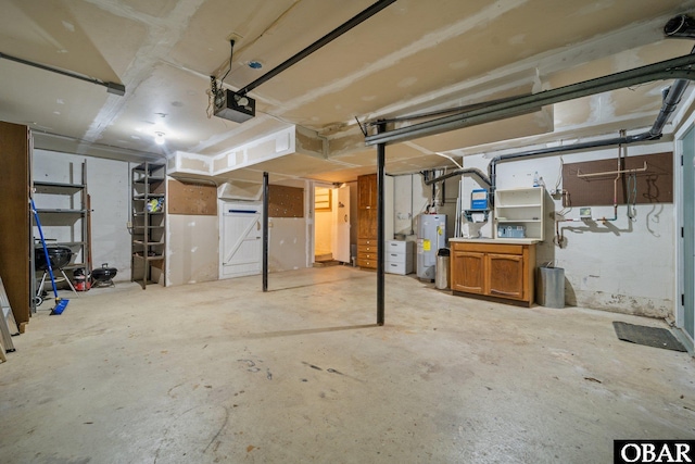 56 Ginguite Trl Lot 9, Southern Shores, NC 27949 - garage featuring a garage door opener and electric water heater
