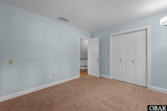 56 Ginguite Trl Lot 9, Southern Shores, NC 27949 - unfurnished bedroom with carpet flooring, baseboards, and a closet