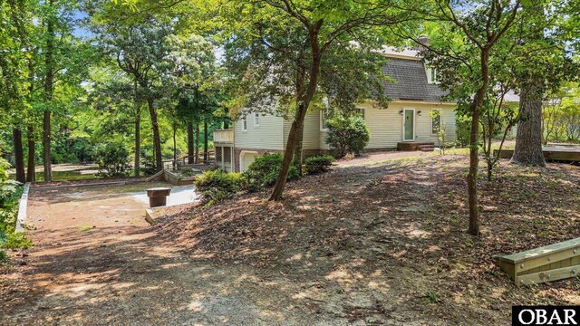 56 Ginguite Trl Lot 9, Southern Shores, NC 27949 - view of yard featuring an attached garage