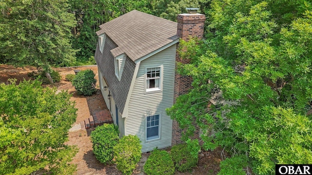 56 Ginguite Trl Lot 9, Southern Shores, NC 27949 - view of home's exterior with a chimney