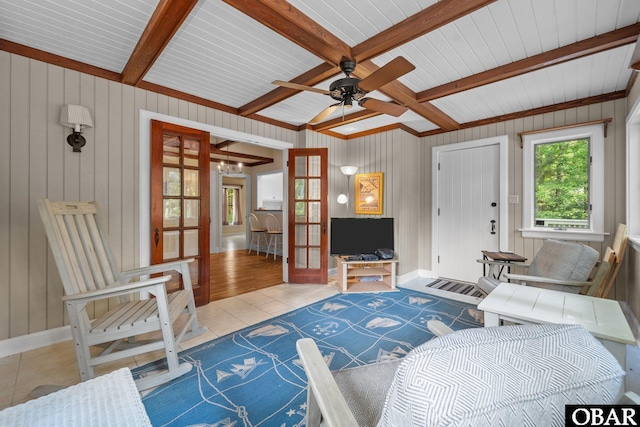 56 Ginguite Trl Lot 9, Southern Shores, NC 27949 - tiled living room featuring a ceiling fan, beam ceiling, wooden walls, french doors, and baseboards