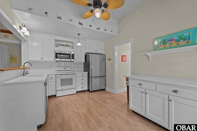 56 Ginguite Trl Lot 9, Southern Shores, NC 27949 - kitchen with open shelves, stainless steel appliances, a ceiling fan, a sink, and white cabinets