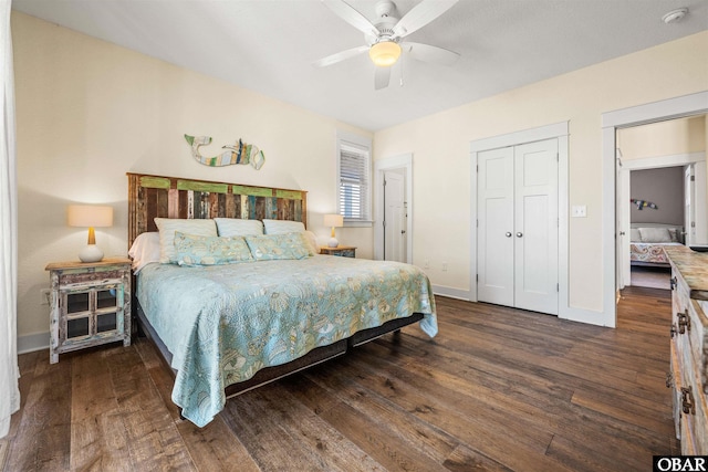 bedroom with ceiling fan, dark wood-style flooring, and baseboards