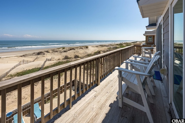 balcony with a view of the beach and a water view