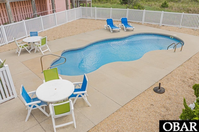 57233 Summerplace Dr Lot 26, Hatteras, NC 27943 - view of pool featuring a patio, outdoor dining space, and a fenced backyard