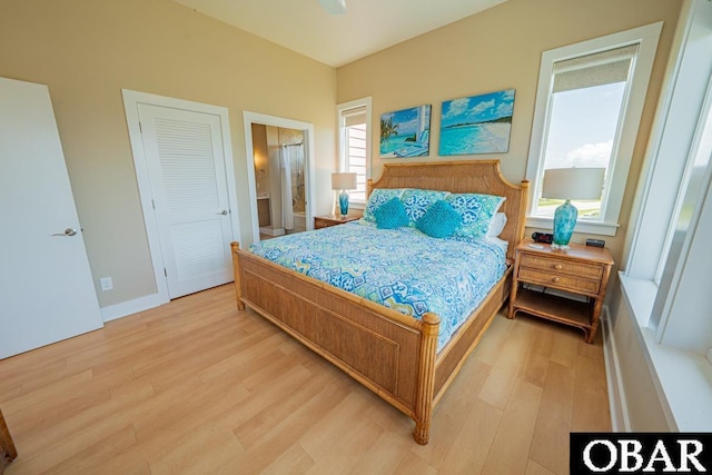 57233 Summerplace Dr Lot 26, Hatteras, NC 27943 - bedroom with light wood-style floors and ensuite bath