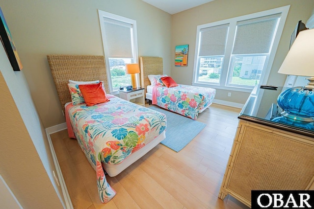 57233 Summerplace Dr Lot 26, Hatteras, NC 27943 - bedroom featuring multiple windows and light wood-style flooring
