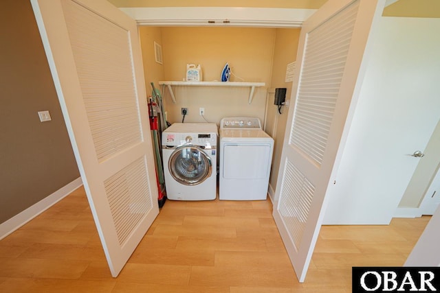 57233 Summerplace Dr Lot 26, Hatteras, NC 27943 - laundry room with washer and clothes dryer and light wood-style flooring