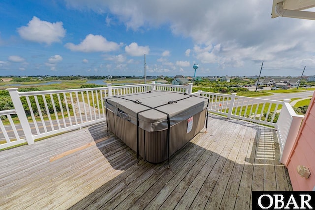 57233 Summerplace Dr Lot 26, Hatteras, NC 27943 - deck featuring a hot tub and a water view