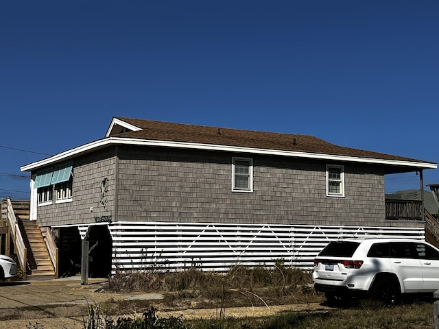 view of property exterior featuring stairway