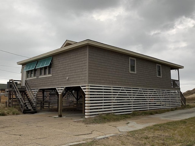 view of home's exterior featuring stairway