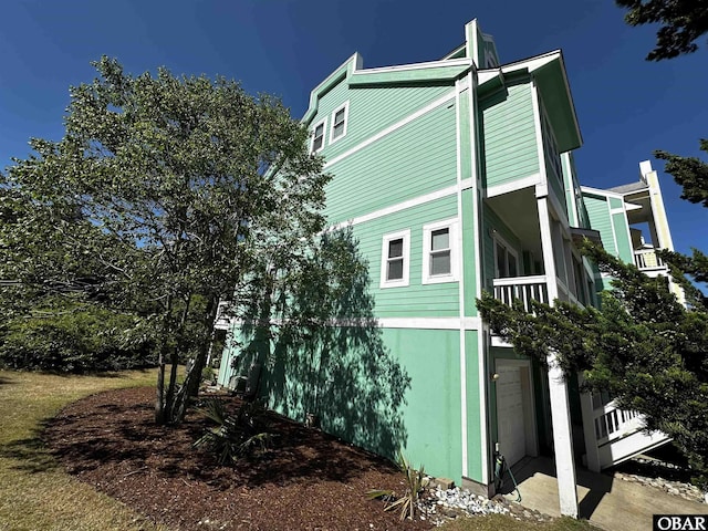 view of side of home featuring a garage