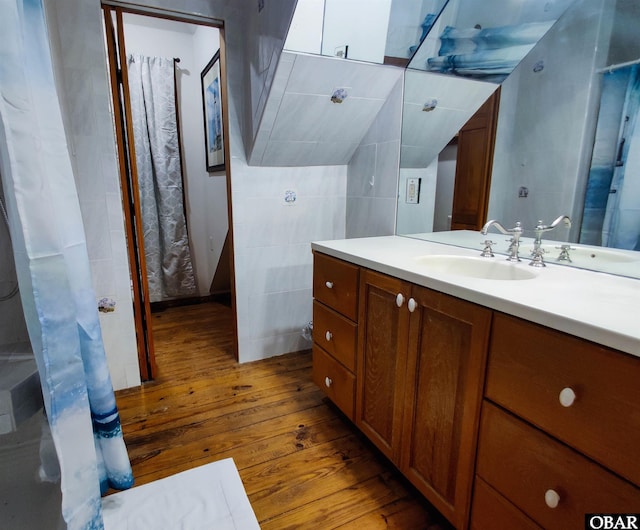 1218 Coral Ln Lot 4, Corolla, NC 27927 - bathroom with hardwood / wood-style flooring, vanity, and tile walls
