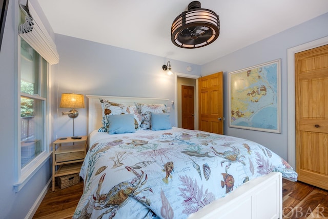 bedroom featuring dark wood-style flooring