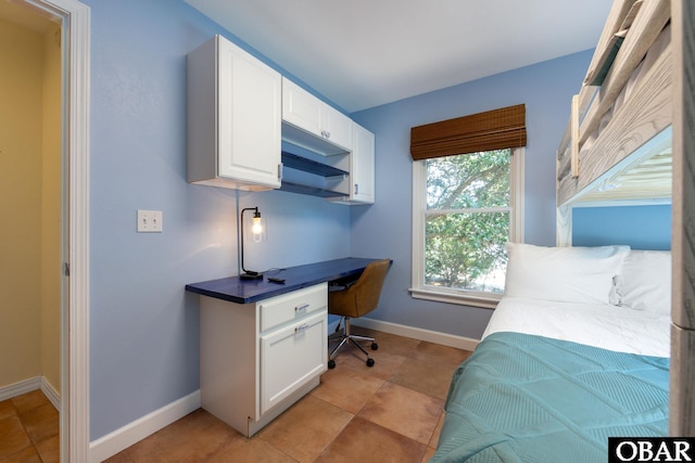 bedroom featuring baseboards