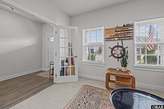 sitting room with french doors and baseboards