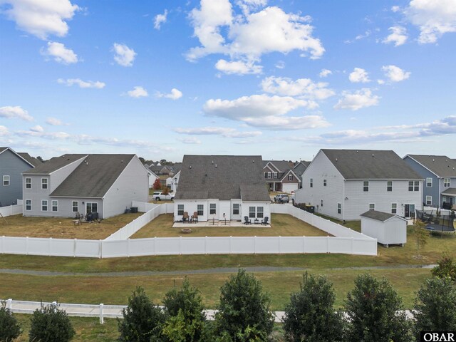 birds eye view of property with a residential view