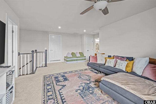 living area with carpet, visible vents, and recessed lighting