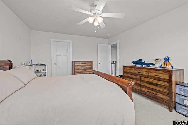 bedroom featuring a ceiling fan and light colored carpet