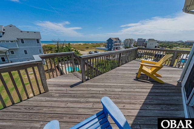 wooden deck featuring a water view