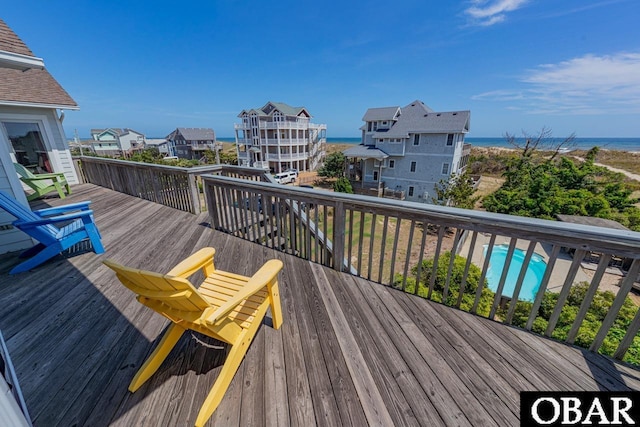 wooden deck with a water view