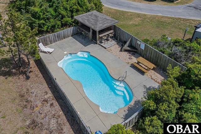 view of pool with a patio, a fenced backyard, and a fenced in pool