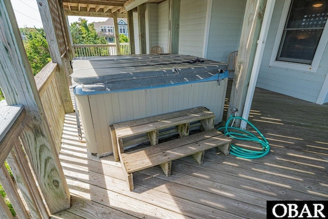 deck with a hot tub
