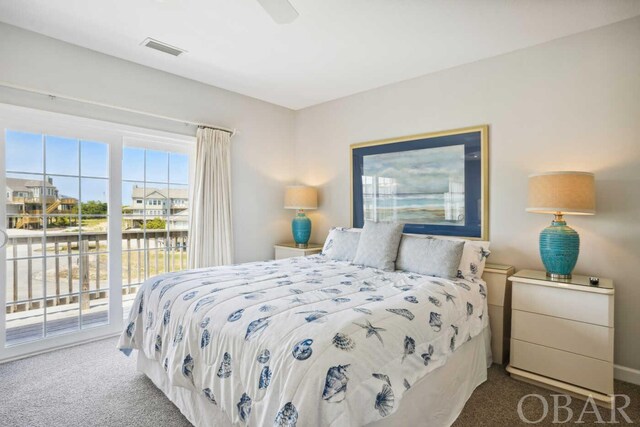 carpeted bedroom featuring a ceiling fan, access to outside, and visible vents