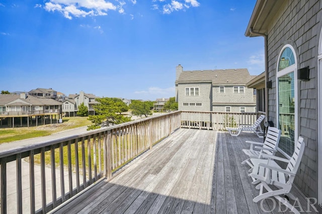 wooden terrace with a residential view