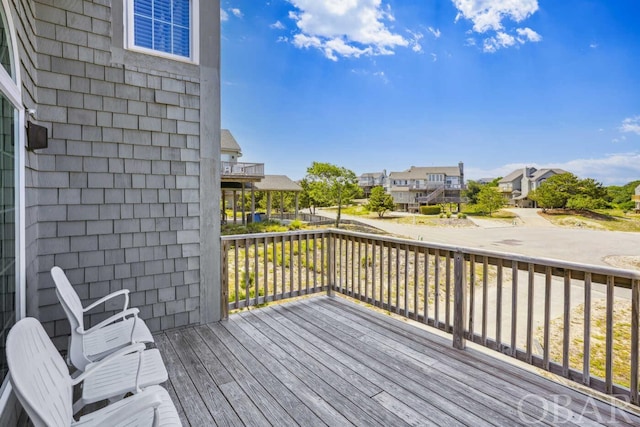 wooden deck featuring a residential view