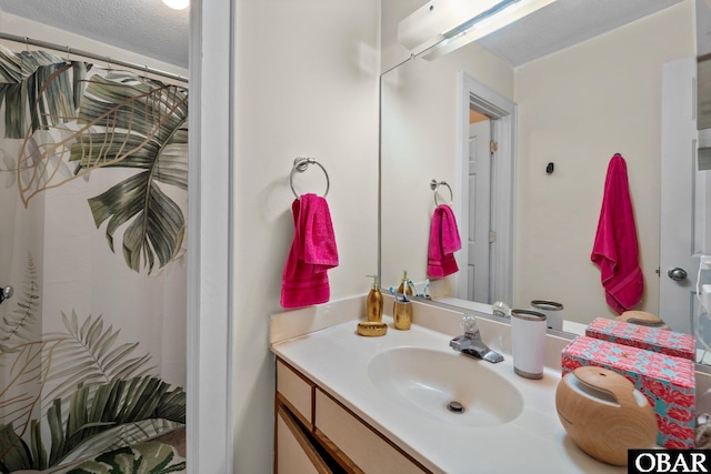 33 Croatan Ct Unit 33, Manteo, NC 27954 - full bath featuring a shower with shower curtain, vanity, and a textured ceiling