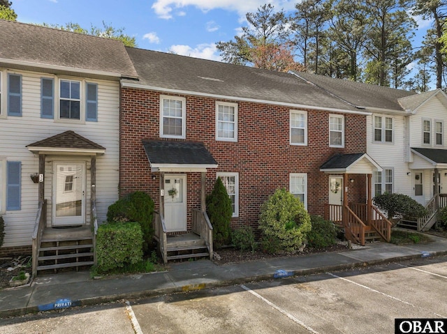 33 Croatan Ct Unit 33, Manteo, NC 27954 - multi unit property with brick siding, a shingled roof, and uncovered parking
