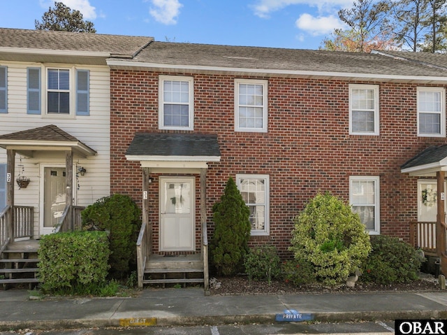 33 Croatan Ct Unit 33, Manteo, NC 27954 - townhome / multi-family property with brick siding and a shingled roof