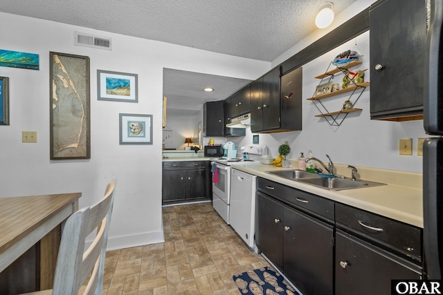 33 Croatan Ct Unit 33, Manteo, NC 27954 - kitchen featuring electric range, under cabinet range hood, visible vents, dishwashing machine, and a sink