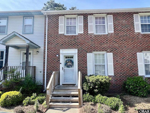 view of property featuring brick siding