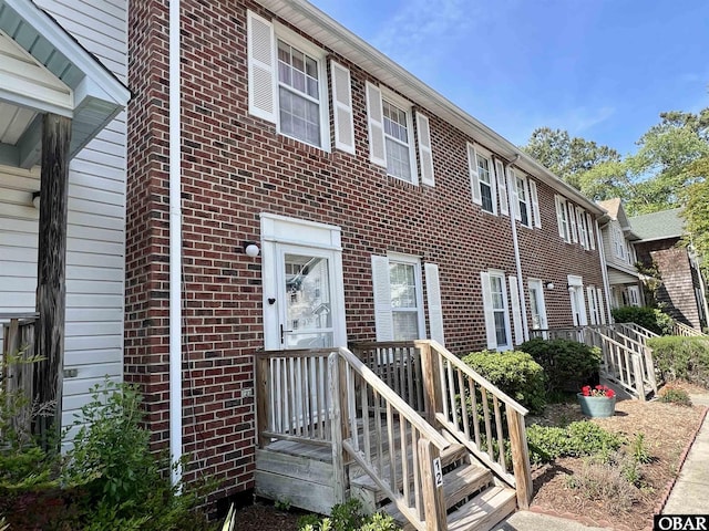 view of property with brick siding